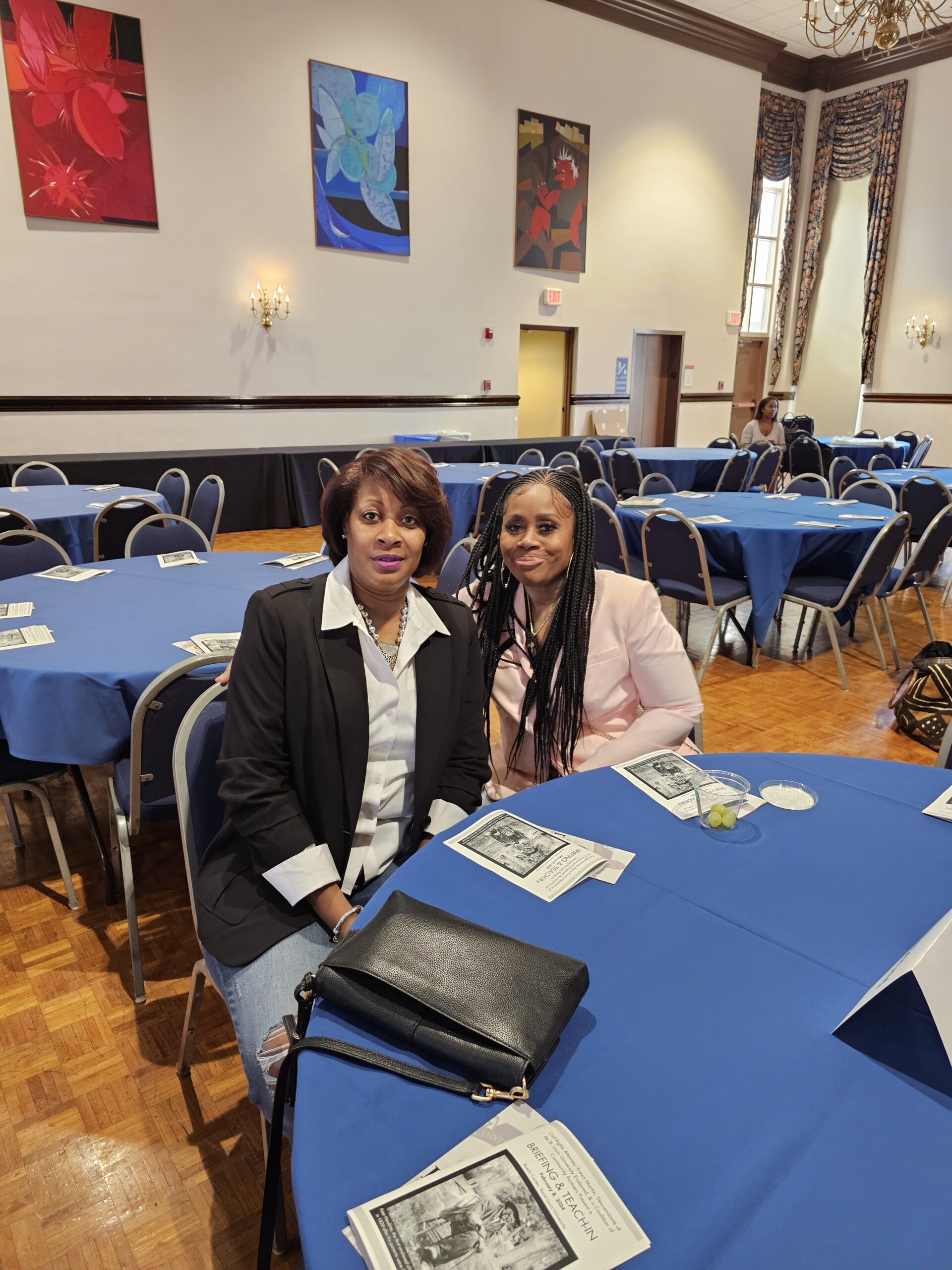 Two Woman On A Table With Magazine