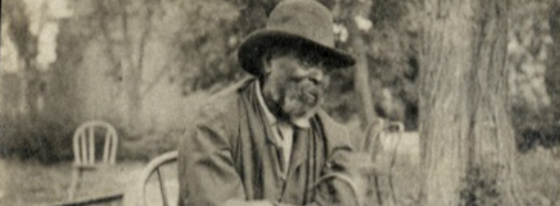 Man Wih Hat In Black And White Image